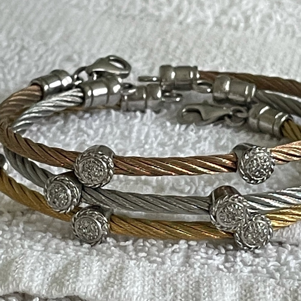 Three stainless steel and diamond station bracelets